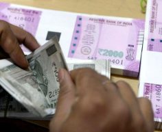 Rupee trades marginally higher against US dollar