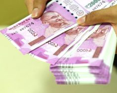 Rupee opens marginally higher against US dollar